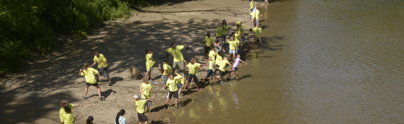 Students exploring a river and nature