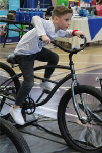Photo of health fair participant on a bicycle